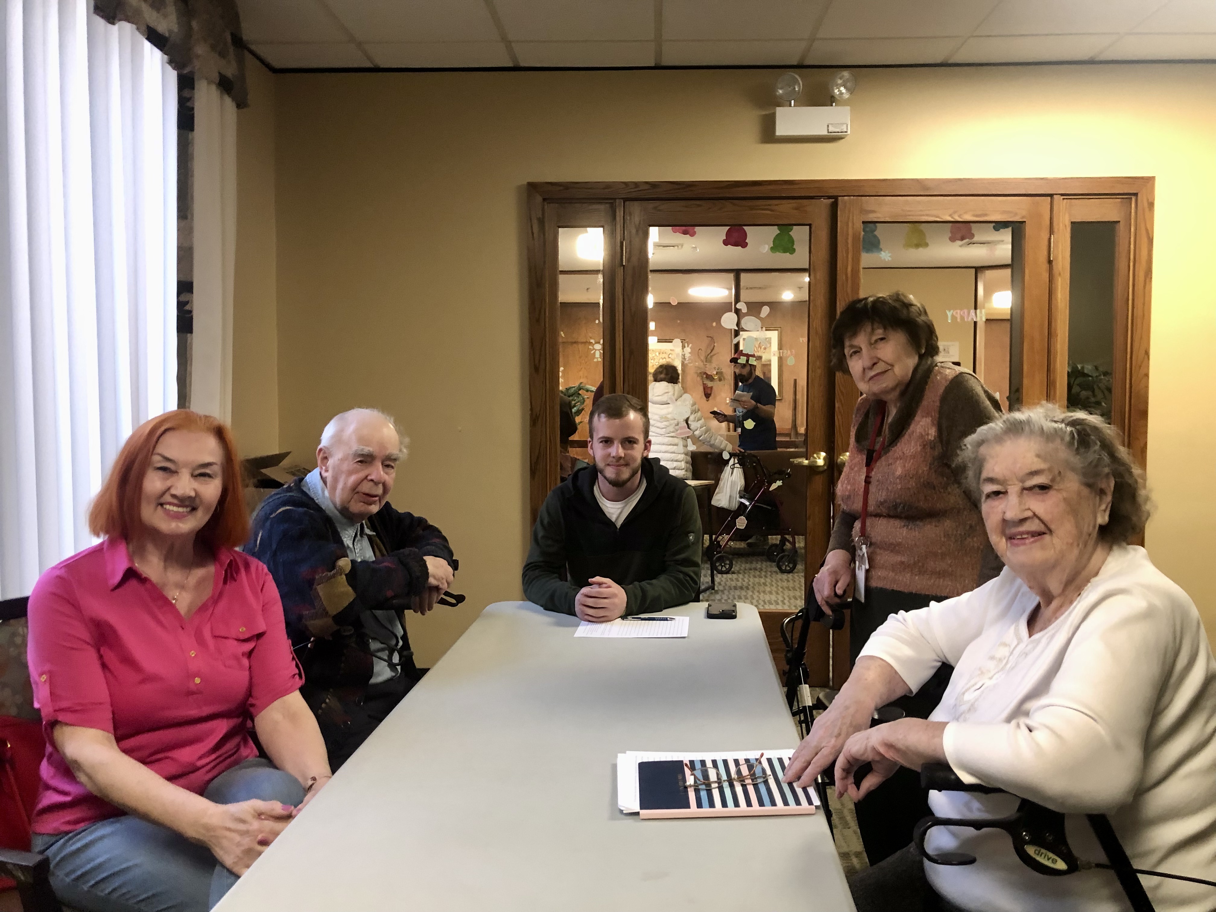 Paul (center), a junior Biblical Studies major, teaches Russian speakers (left to right) Valeriya, Gregori, Chaisa, and Alla in a conversational English class run by a Moody Practical Christian Ministry near the Chicago campus.