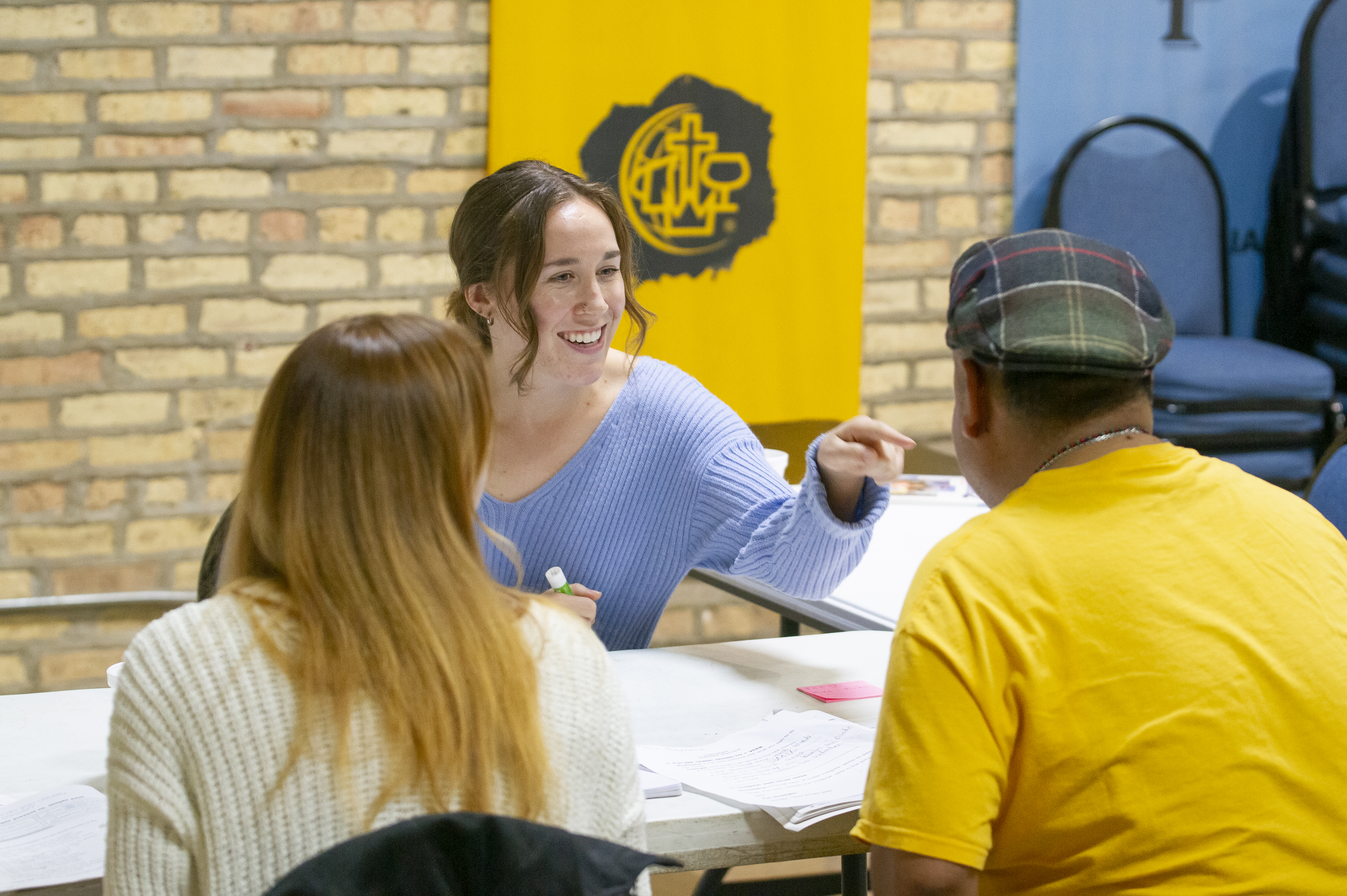 Grace, a student at Moody Bible Institute, teaches conversational English during a class at the Family Empowerment Center in Chicago's Rogers Park.