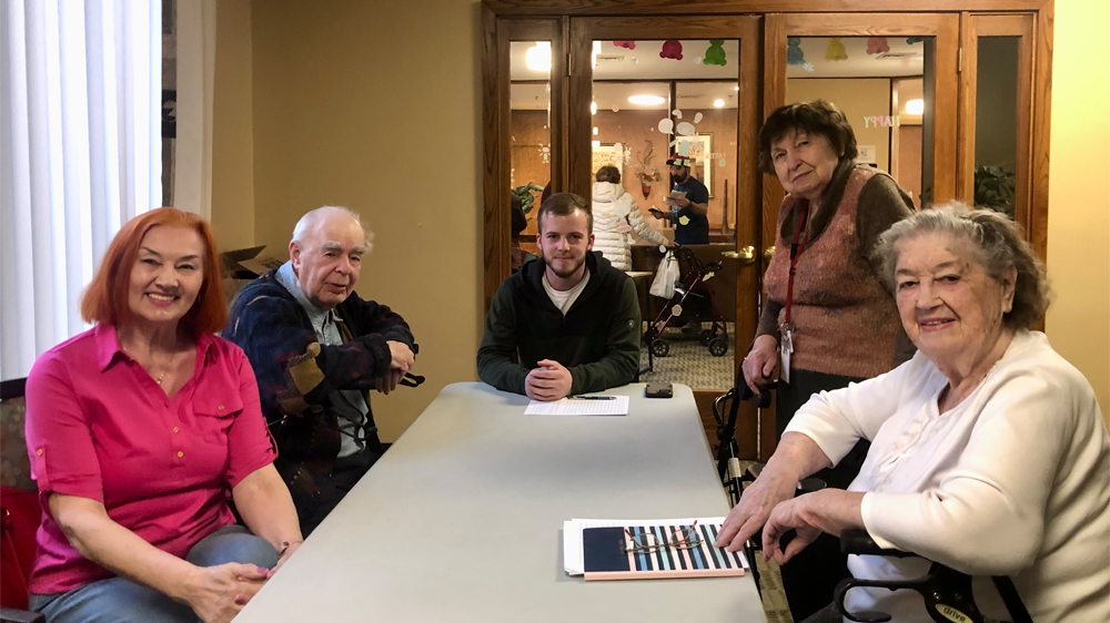 Paul (center), a junior Biblical Studies major, teaches Russian speakers in a conversational English class run by a Moody Practical Christian Ministry.