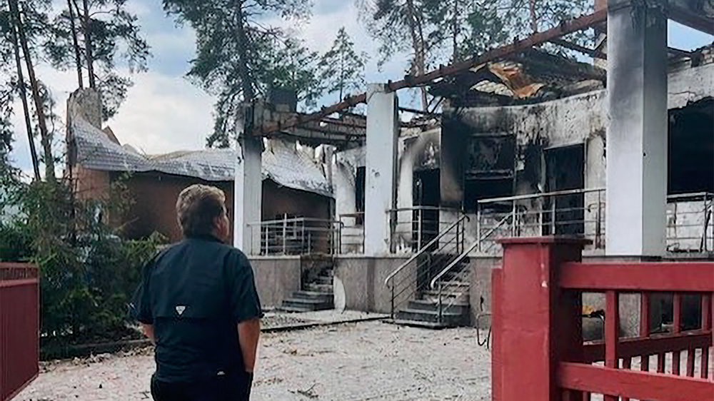 Sergey Rakhuba '95 surveys the destruction of Mission Eurasia's ministry headquarters in Irpin, Ukraine.