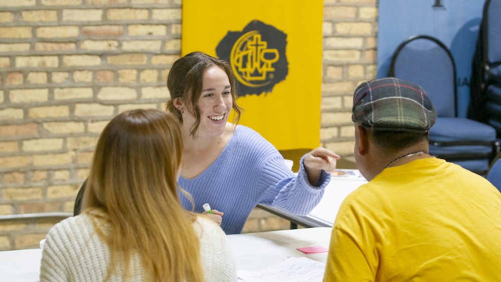 Grace, a student at Moody Bible Institute, teaches conversational English during a class at the Family Empowerment Center in Chicago's Rogers Park.